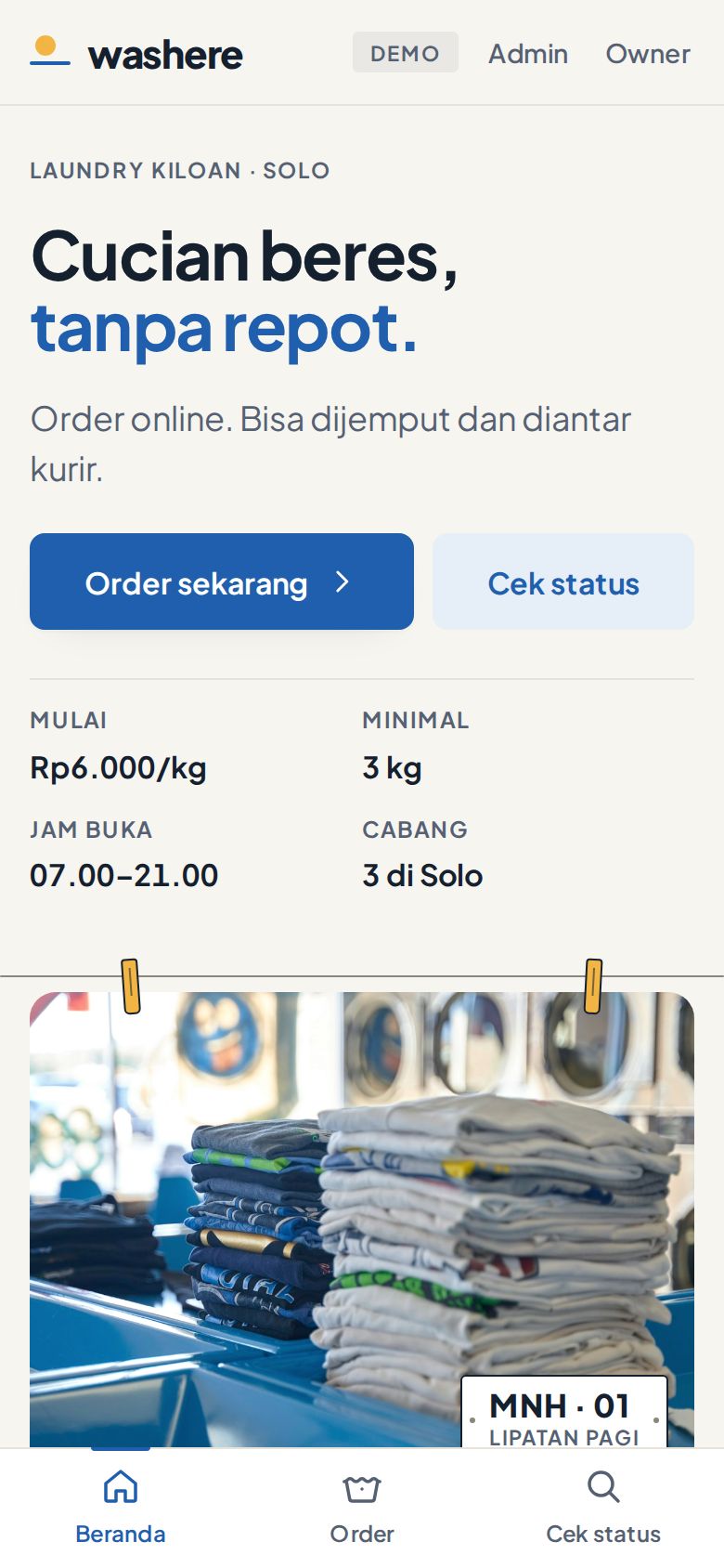 Beranda demo Washere Laundry di layar ponsel dengan navigasi bawah